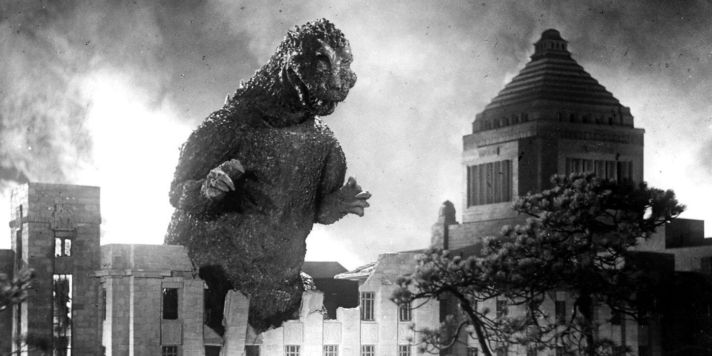 Gojira Godzilla destroying a building in black and white