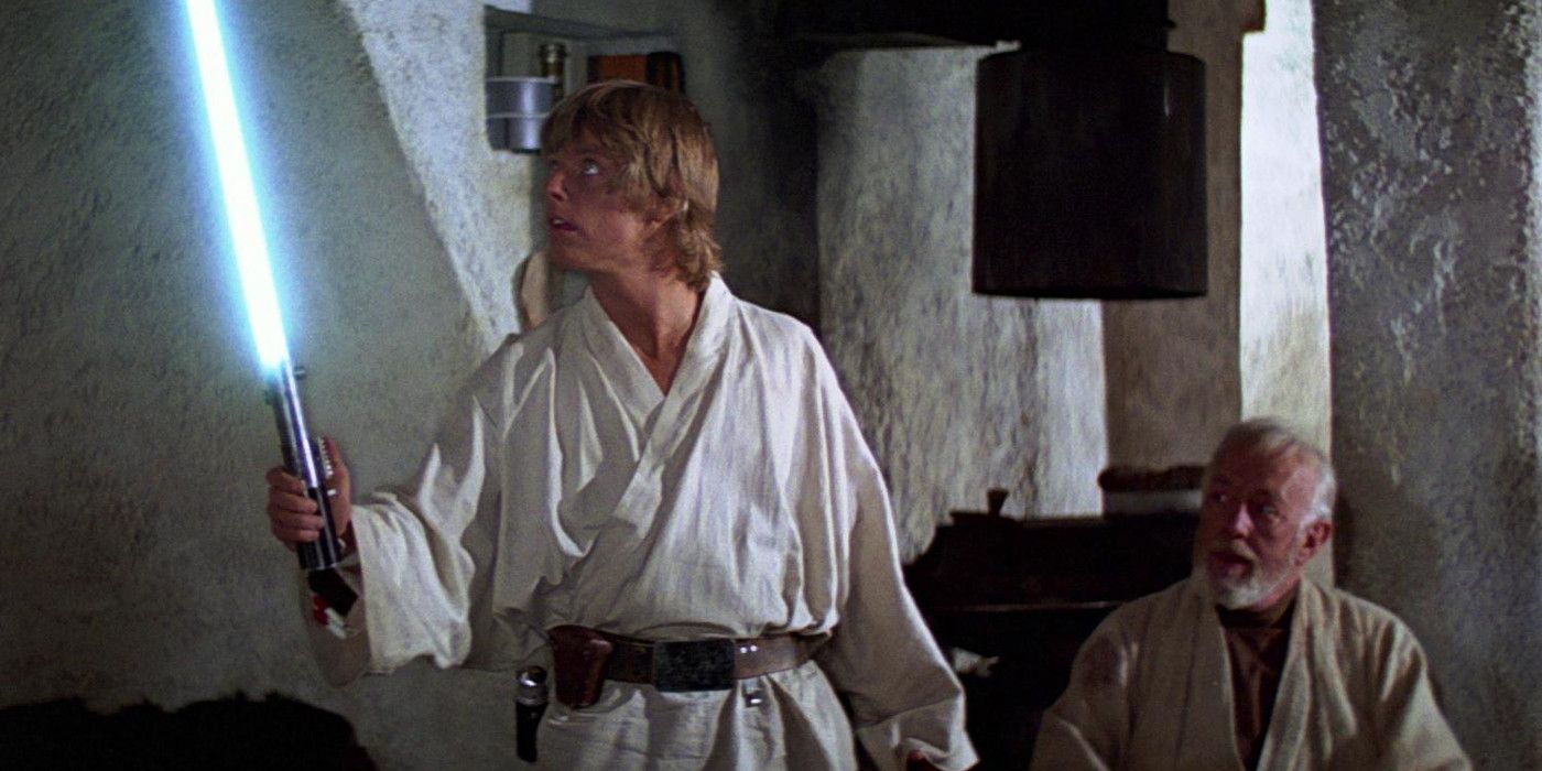 Luke and Obi Wan Kenobi With Anakins Lightsaber