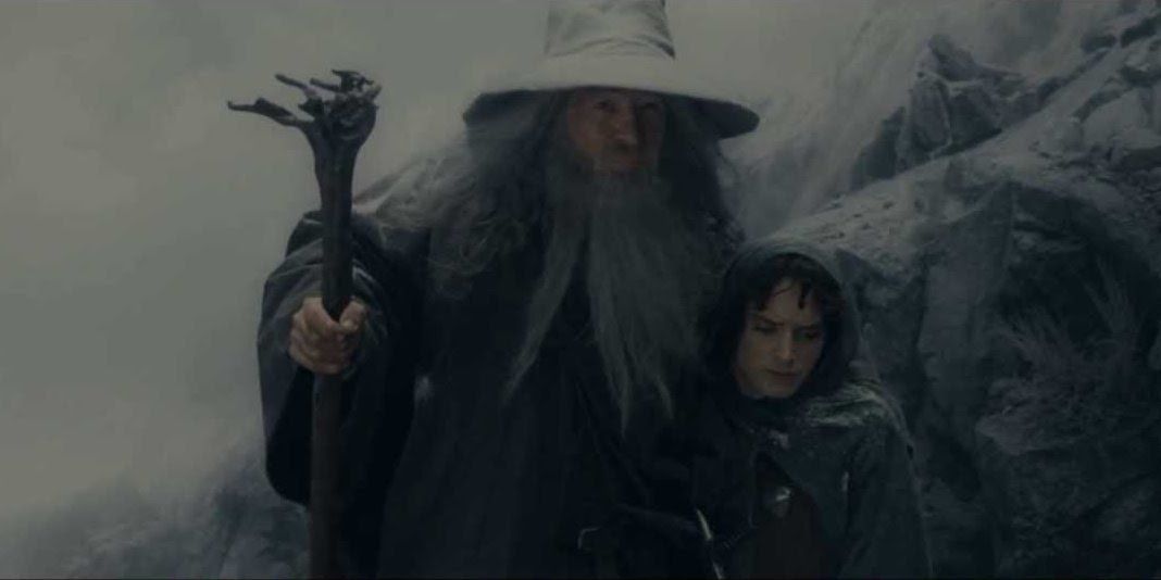 Gandalf holding Frodo in the snow outside Moria in The Lord of the Rings The Fellowship of the Ring Extended Edition