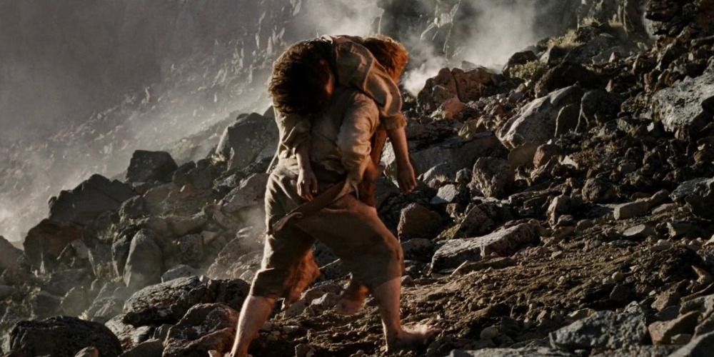Sam carries Frodo up the slopes of Mount Doom