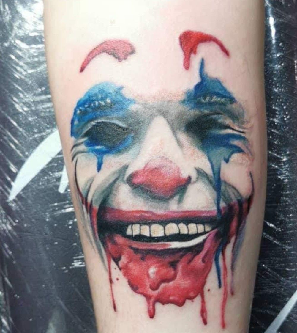 Татуировка улыбка Джокера