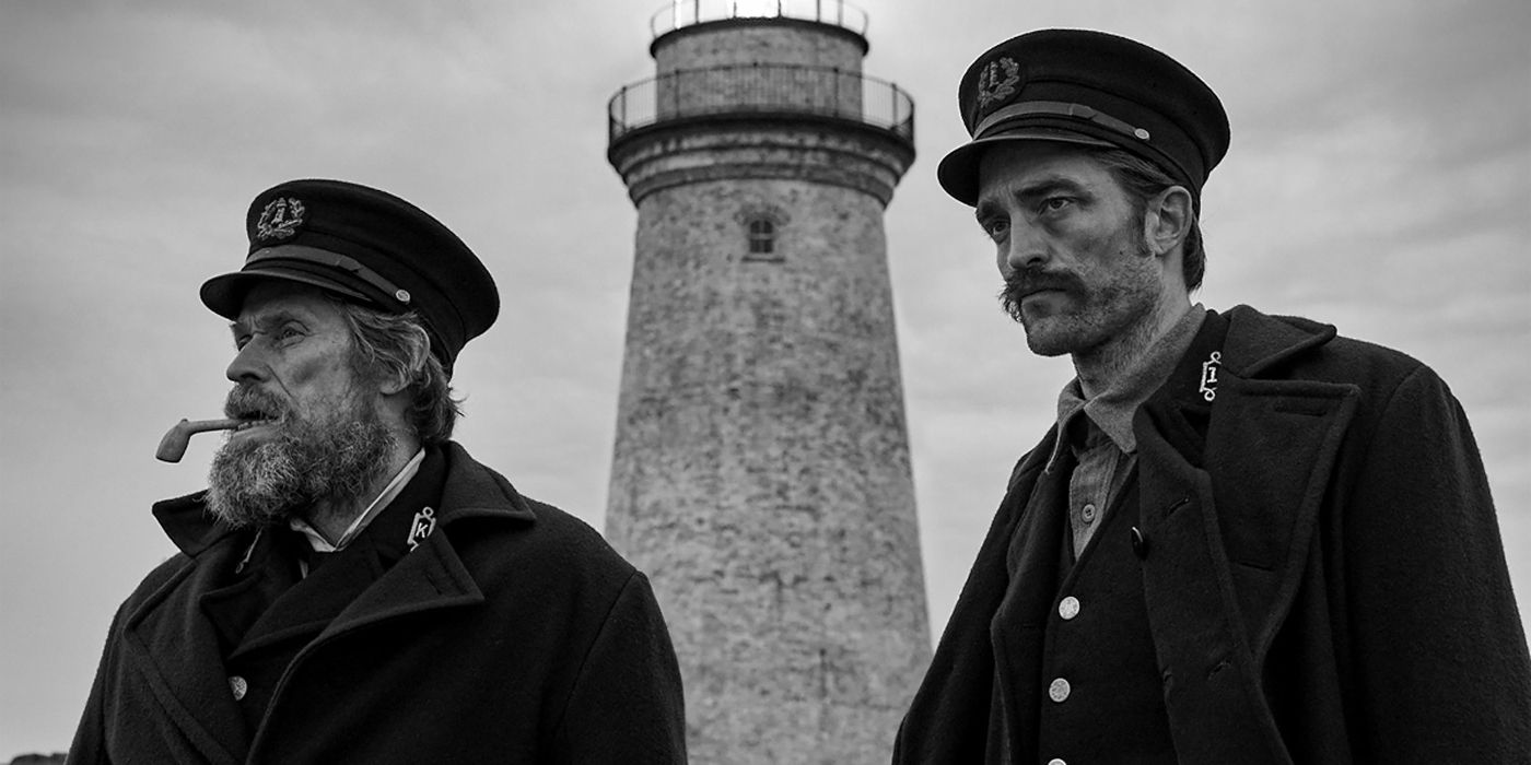The two lighthouse keepers outdoors in The Lighthouse
