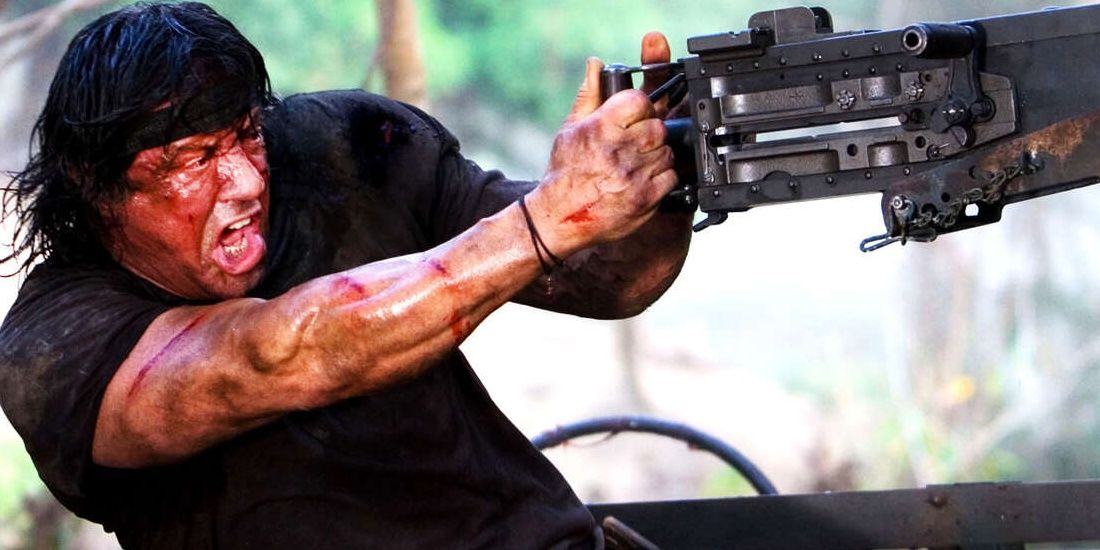 Sylvester Stallone firing a machine gun in a still from John Rambo Cropped