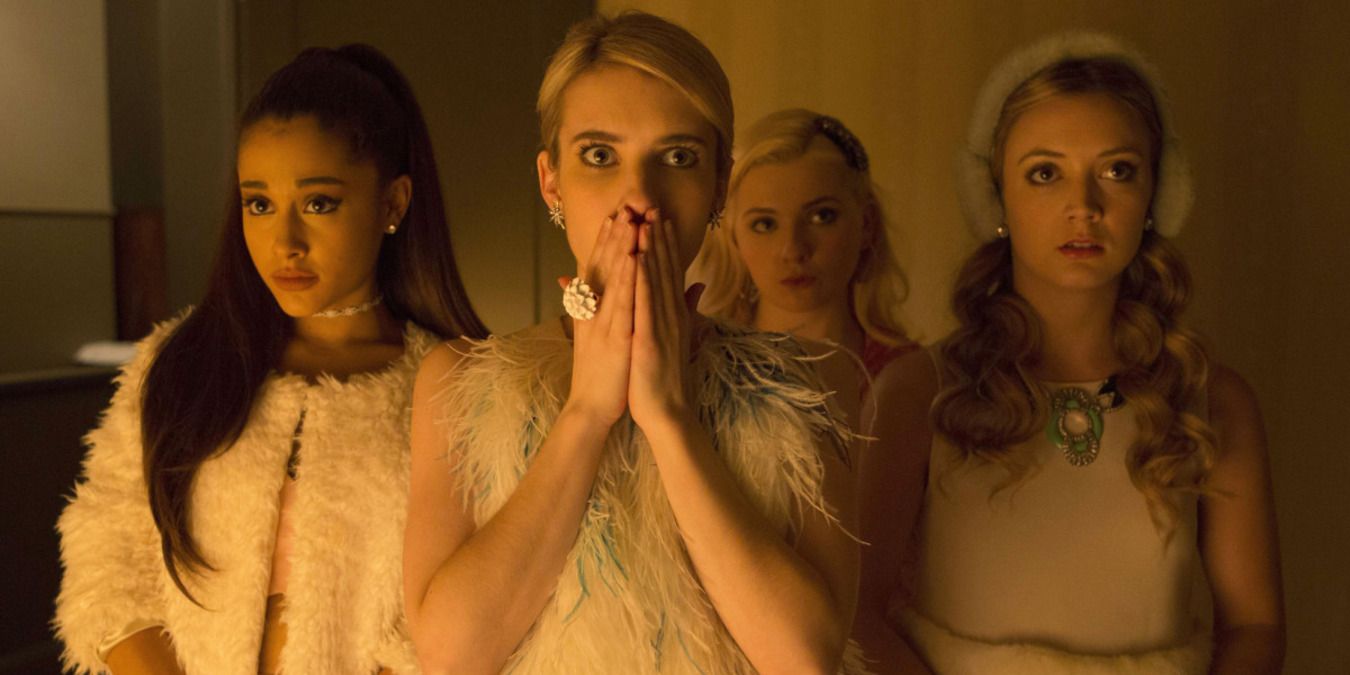 Chanel and her group standing in the house looking scared and shocked in Scream Queens