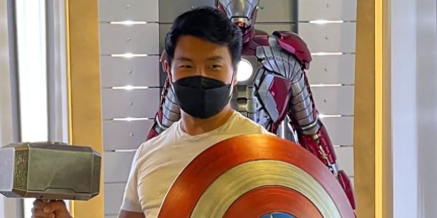 ShangChis Simu Liu Poses With Captain America’s Shield & Mjolnir