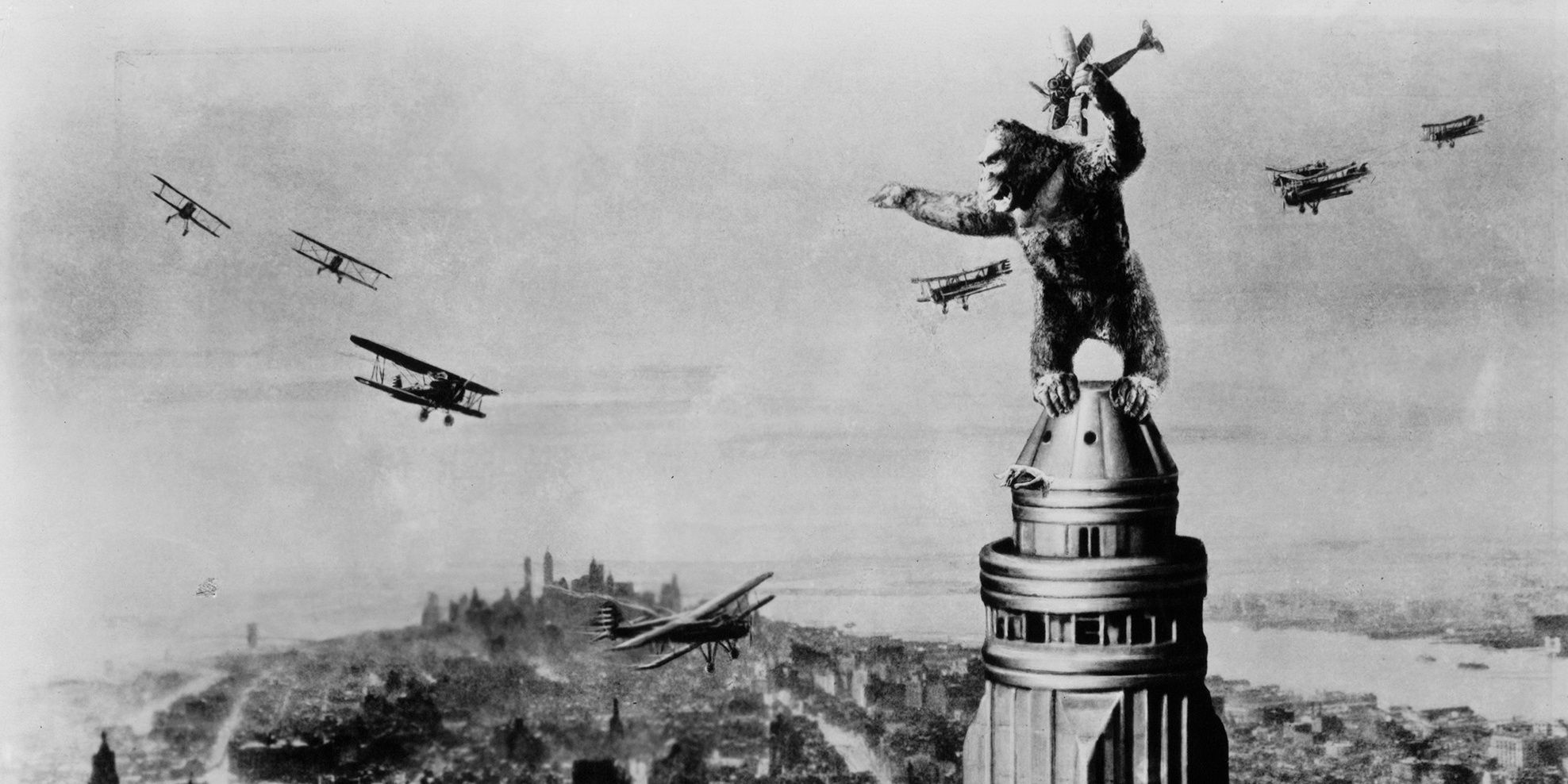 King Kong on top of the Empire State Building surrounded by planes in original 1933 King Kong film