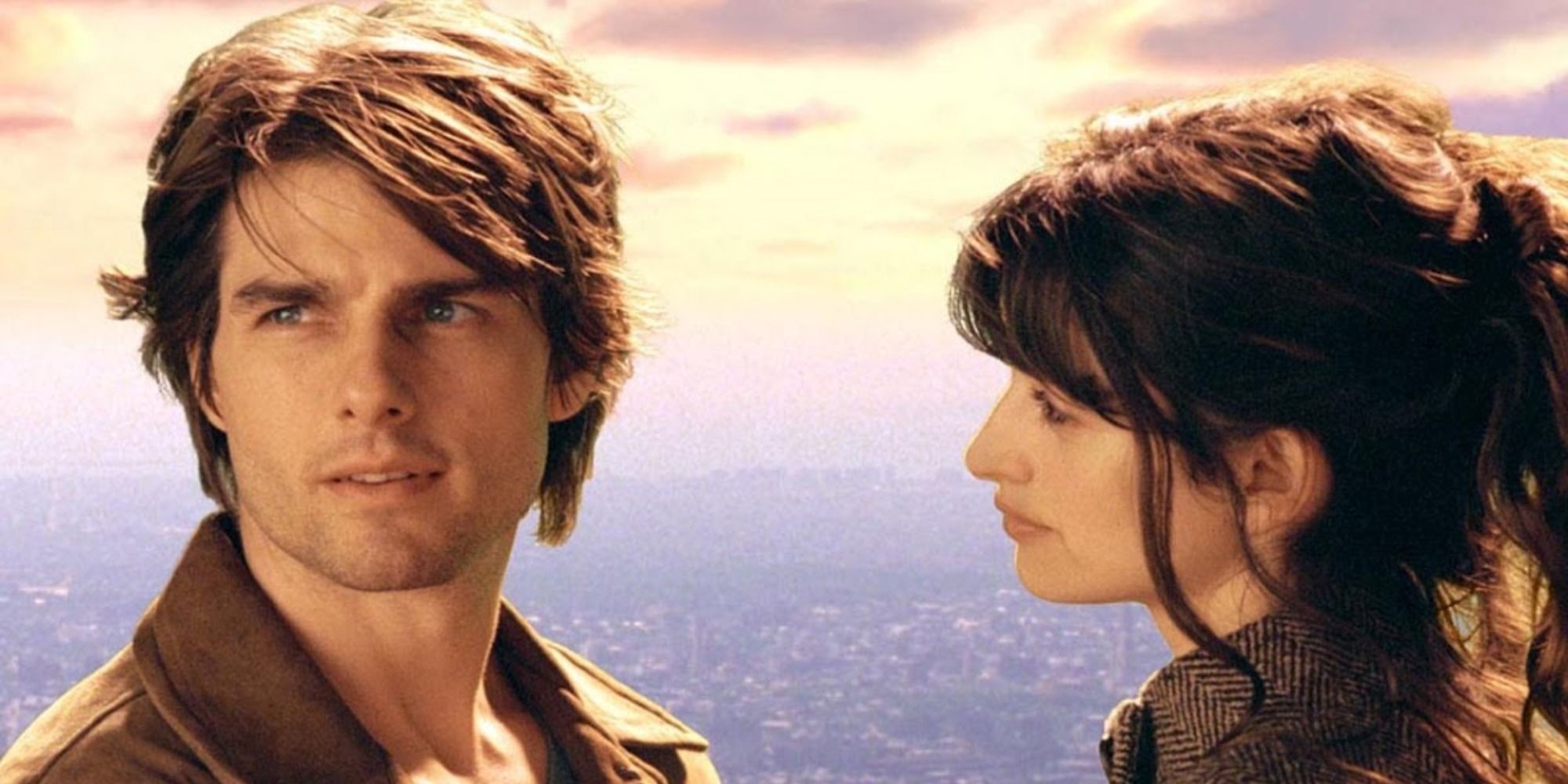 An image of Tom Cruise and Penelope Cruz standing in front of an ocean in Vanilla Sky