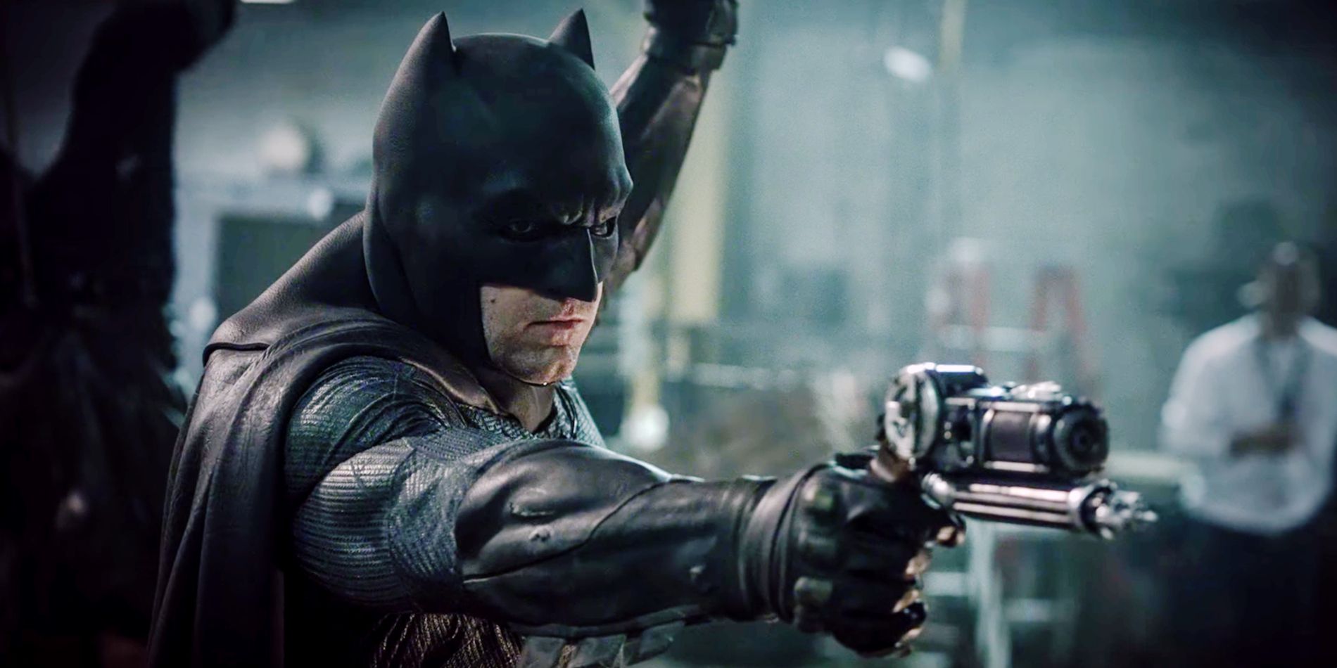Ben Afflecks Batman wielding his grapnel gun in Batman V Superman Dawn Of Justice