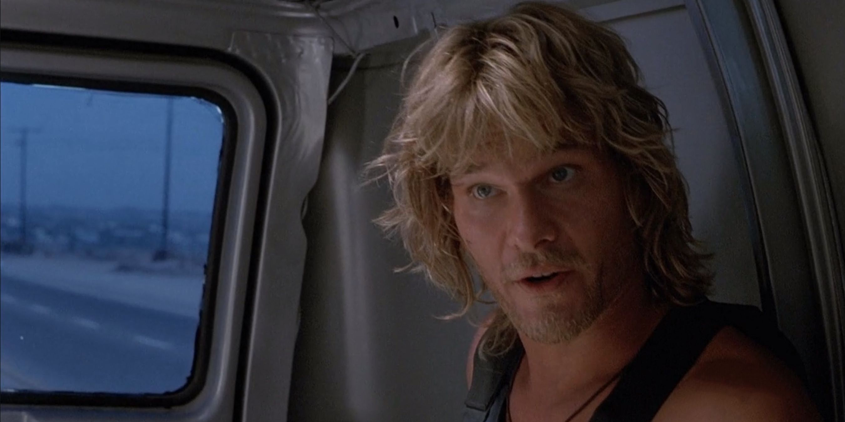 Patrick Swayze as Bodhi in the back of a van in Point Break