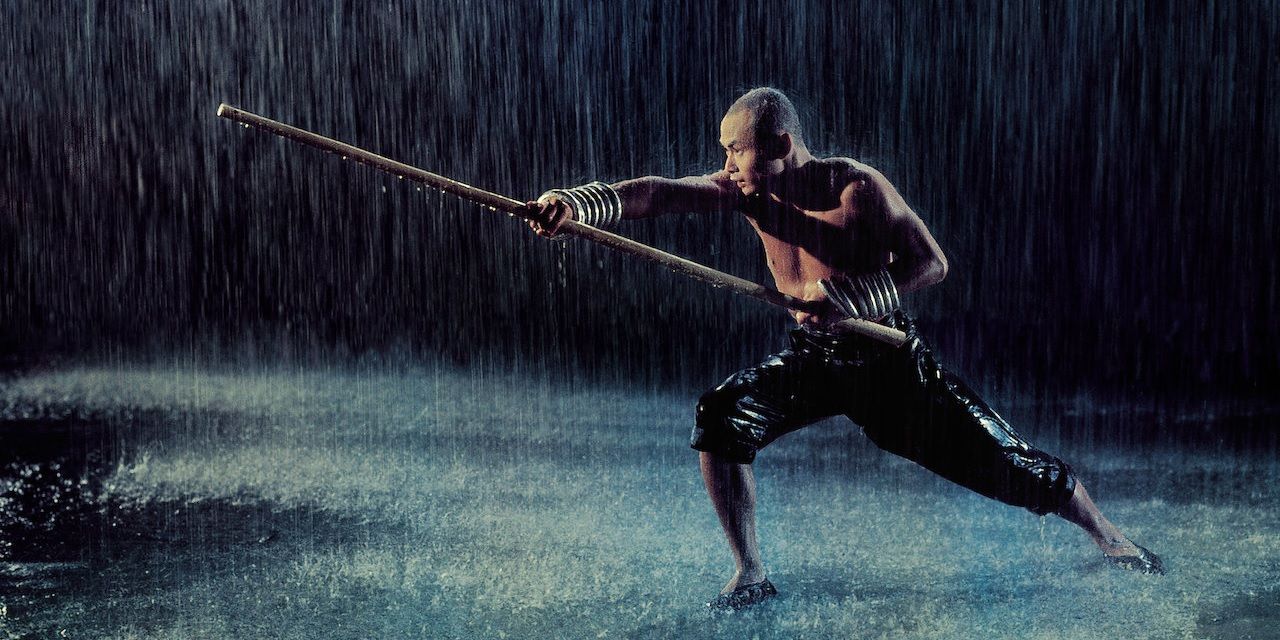 Gordon Liu training in the rain in The 36th Chamber of Shaolin