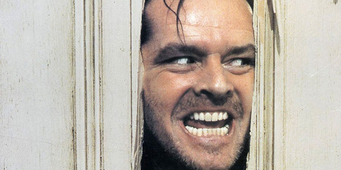 Jack Nicholson looking throught the door in The Shining