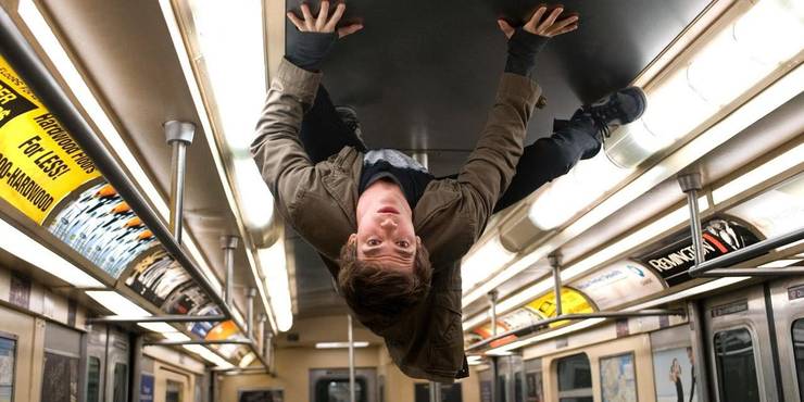 An image of Peter Parker crawling on the ceiling on a subway in Amazing Spider Man.jpg?q=50&fit=crop&w=740&h=370&dpr=1