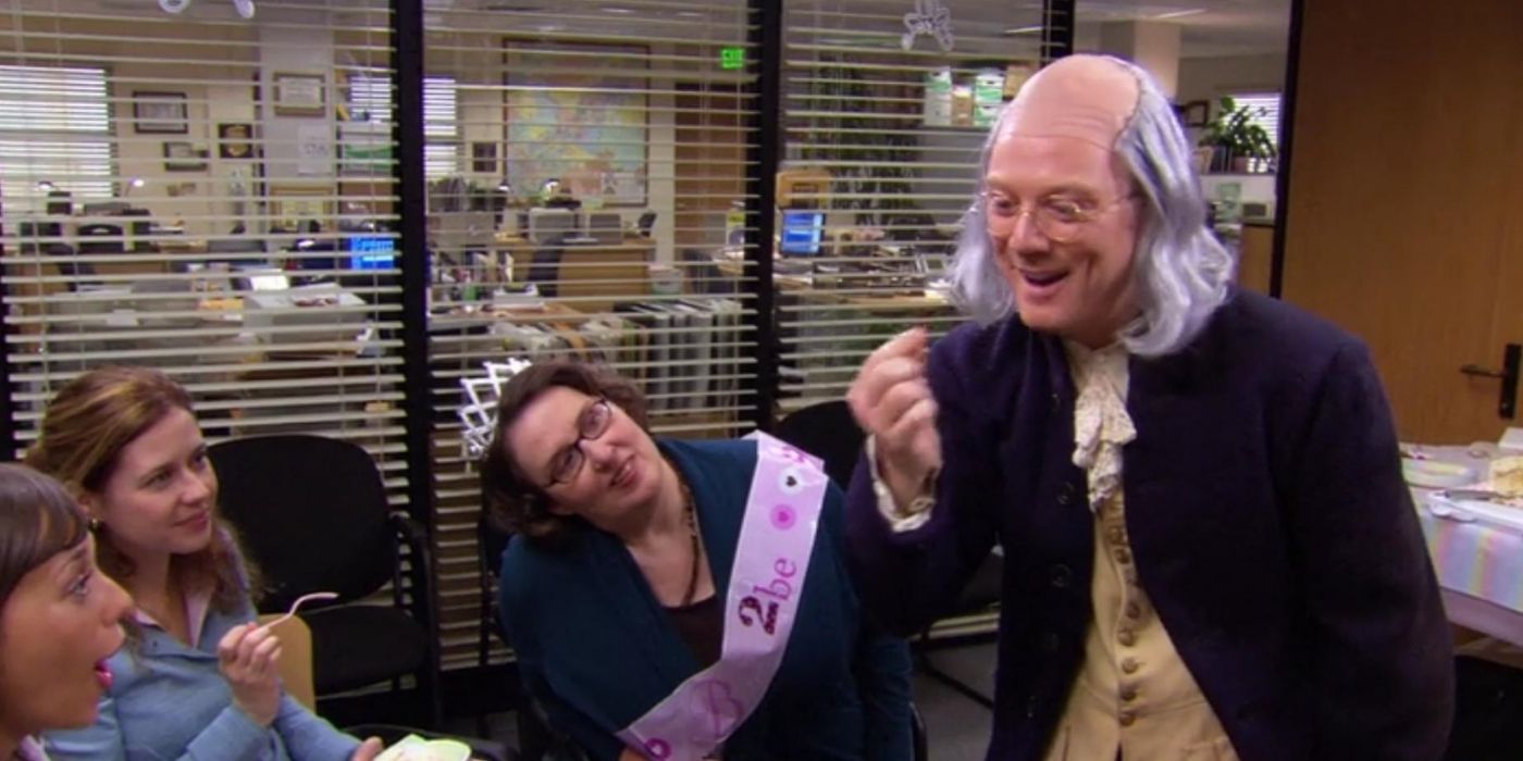 Ben Franklin showing the women of the office how to tie a cherry stem on The Office