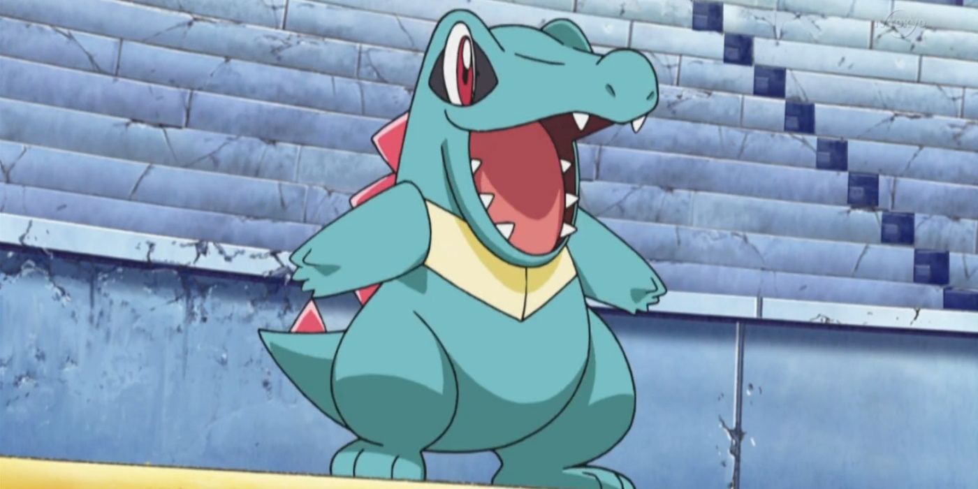Totodile smiles widely in Pokemon