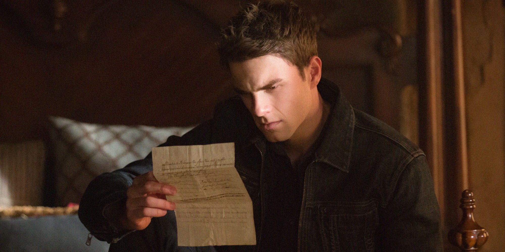 Kol Mikaelson reading a letter