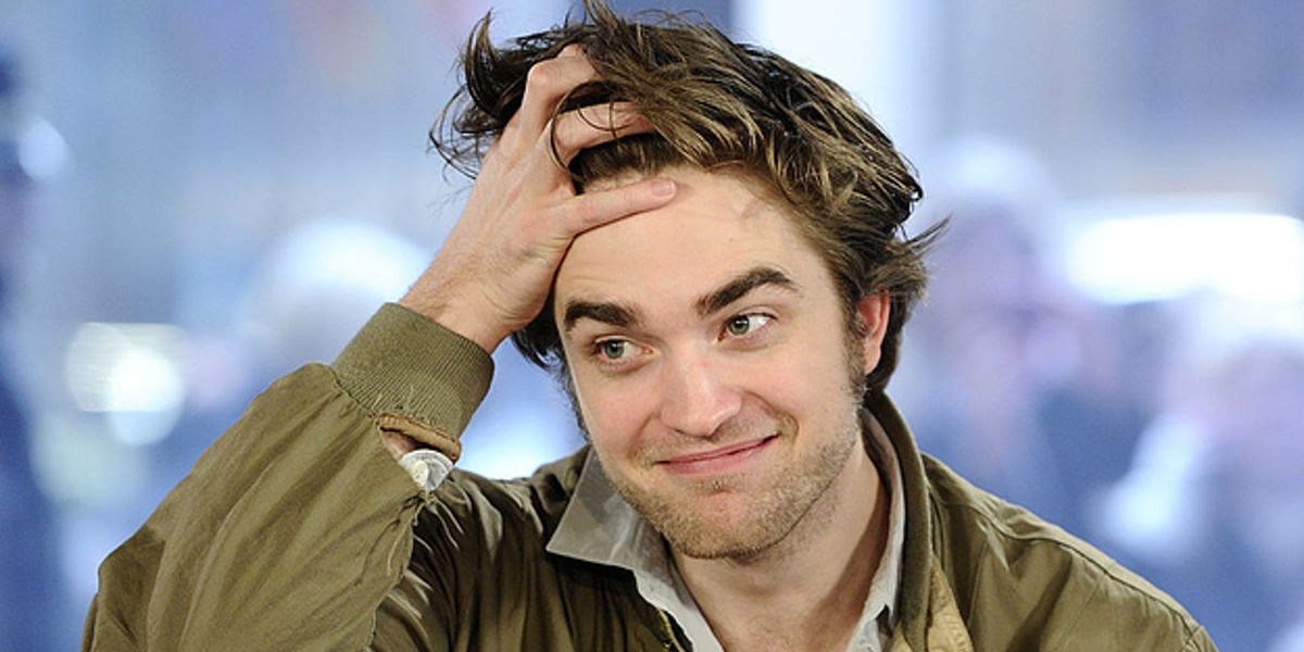 Robert Pattinson with hand in hair 1