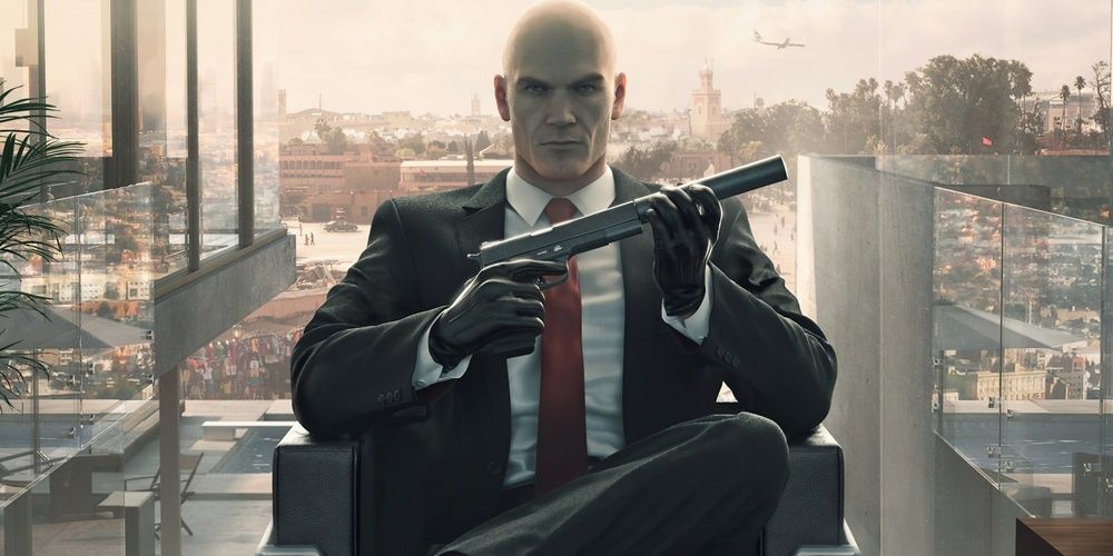 Agent 47 with a gun in hand in Hitman Cropped 1