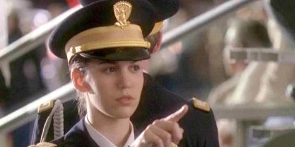 An image of Jennifer Stone pointing to someone off screen in Cadet Kelly