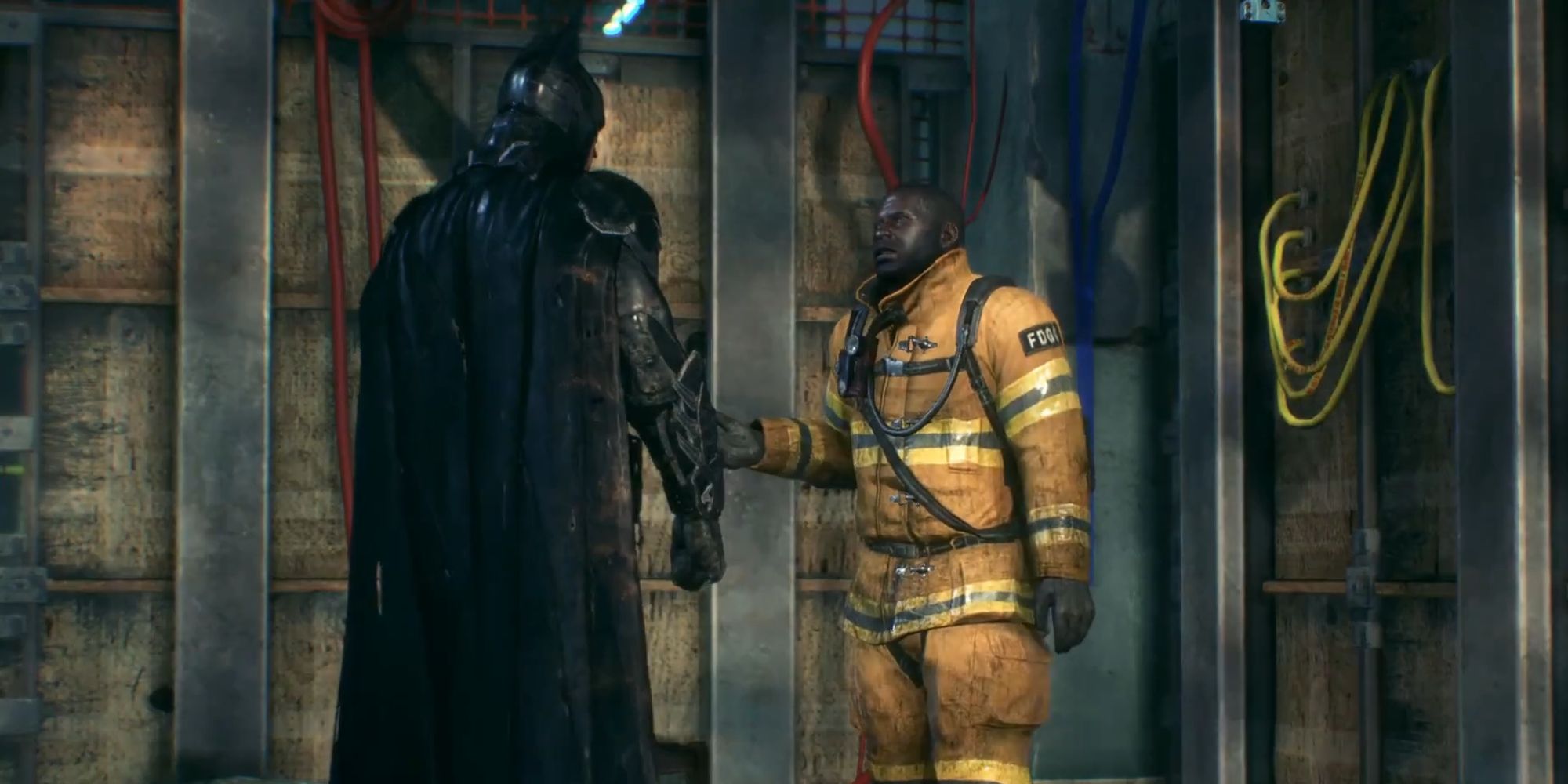 Batman speaking with Firefighter Chief Underhill in Batman Arkham Knight