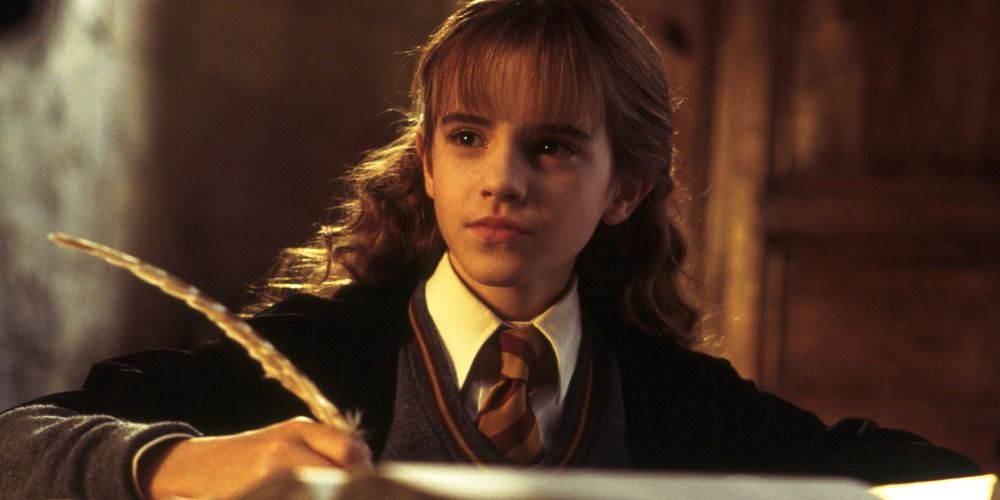 An image of Hermione writing in a book in the Harry Potter movies