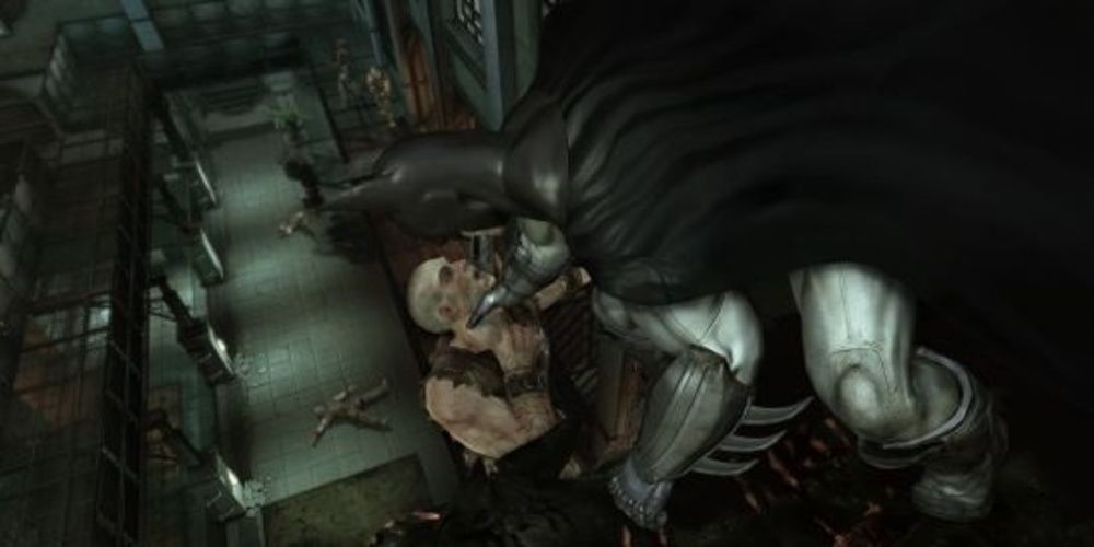 Batman grabs a thug by the throat in Arkham Asylum Cropped 1
