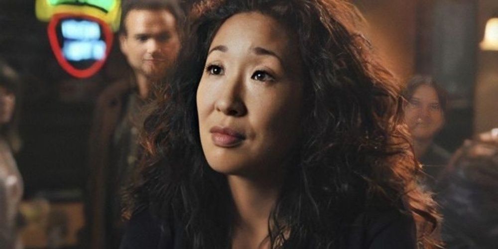 Cristina Yang sitting at a bar in Greys Anatomy Cropped 1