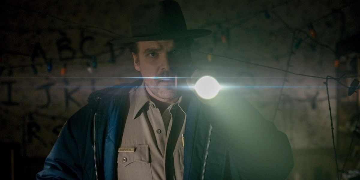 Hopper using a flashlight in Stranger Things Cropped