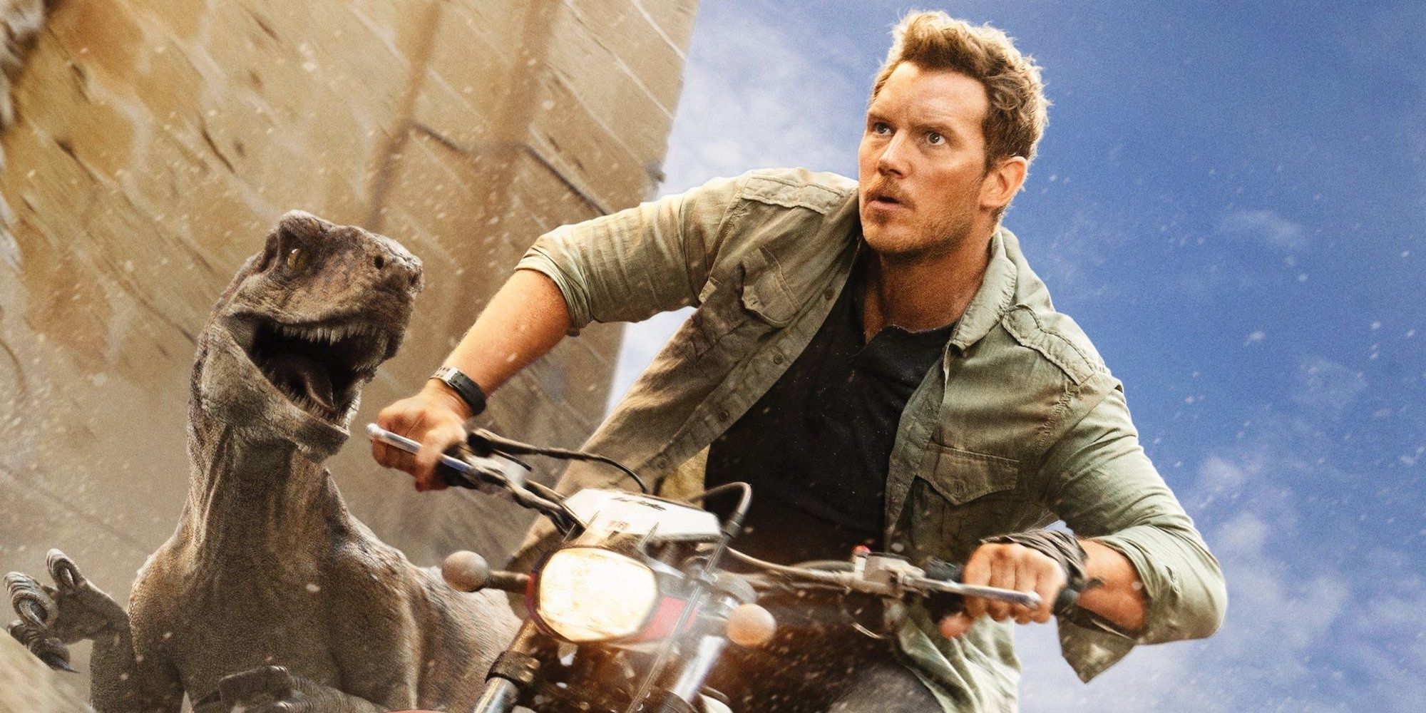 Owen Grady riding a bike and escaping from a raptor in Jurassic World Dominion Cropped